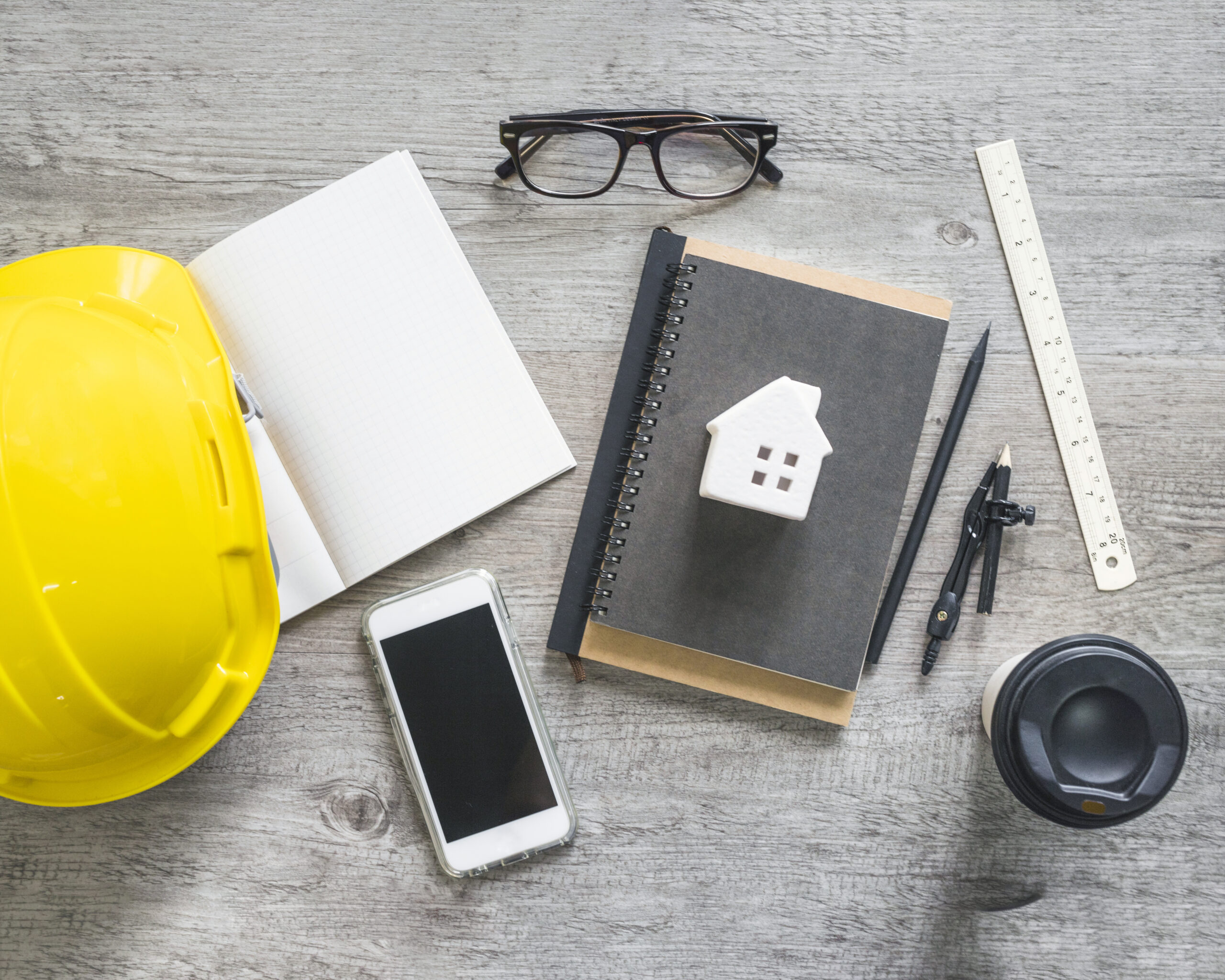 hardhat-stationery-near-smartphone-cup