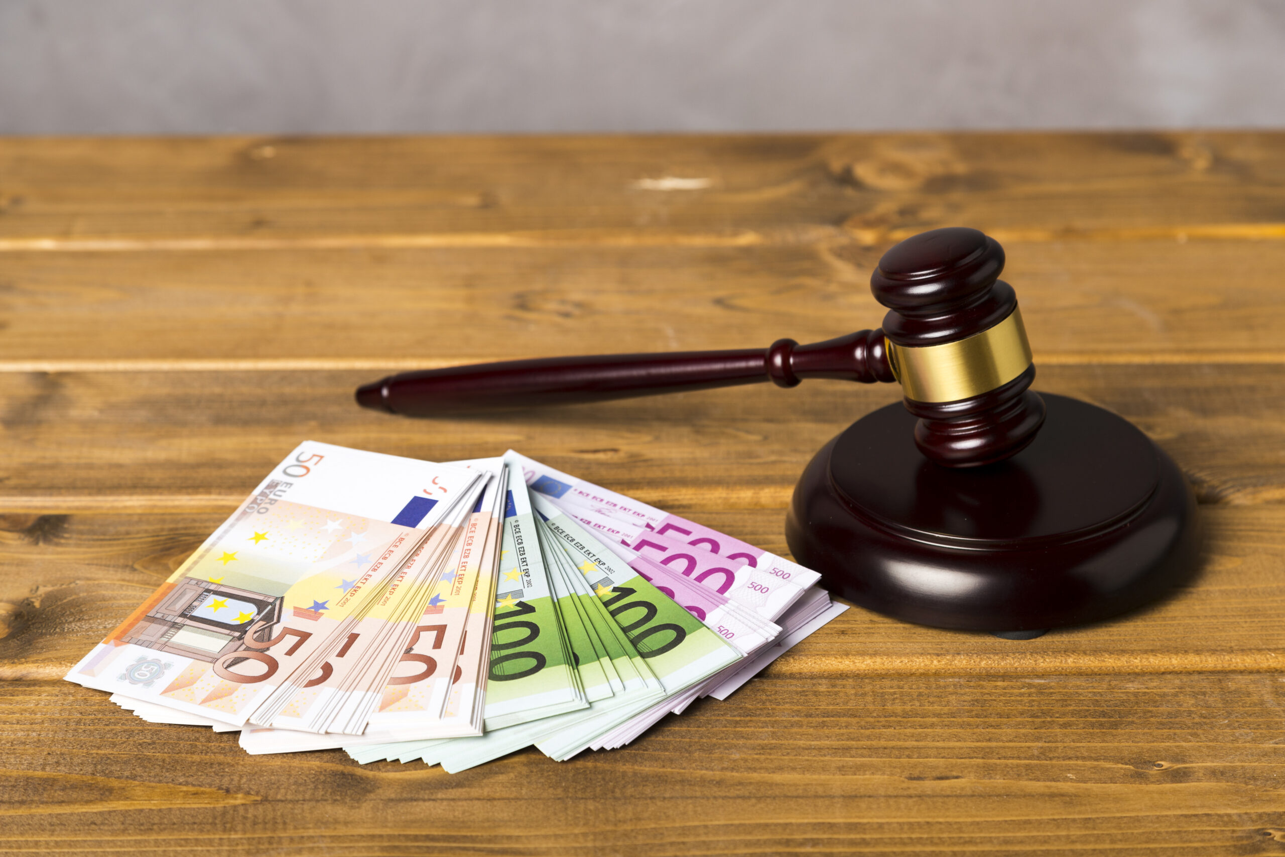 high-angle-judge-gavel-with-euro-banknotes high-angle-judge-gavel-with-euro-banknotes
